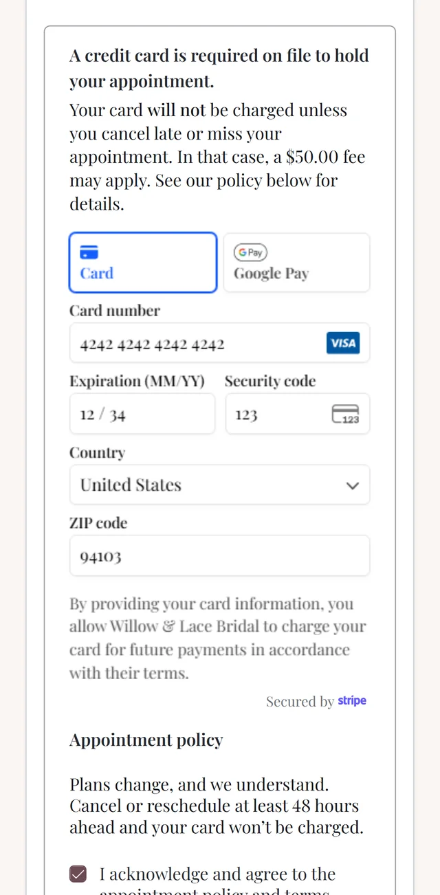 Booking on her phone: a card held on file against a $50 no-show fee, with the boutique’s cancellation policy